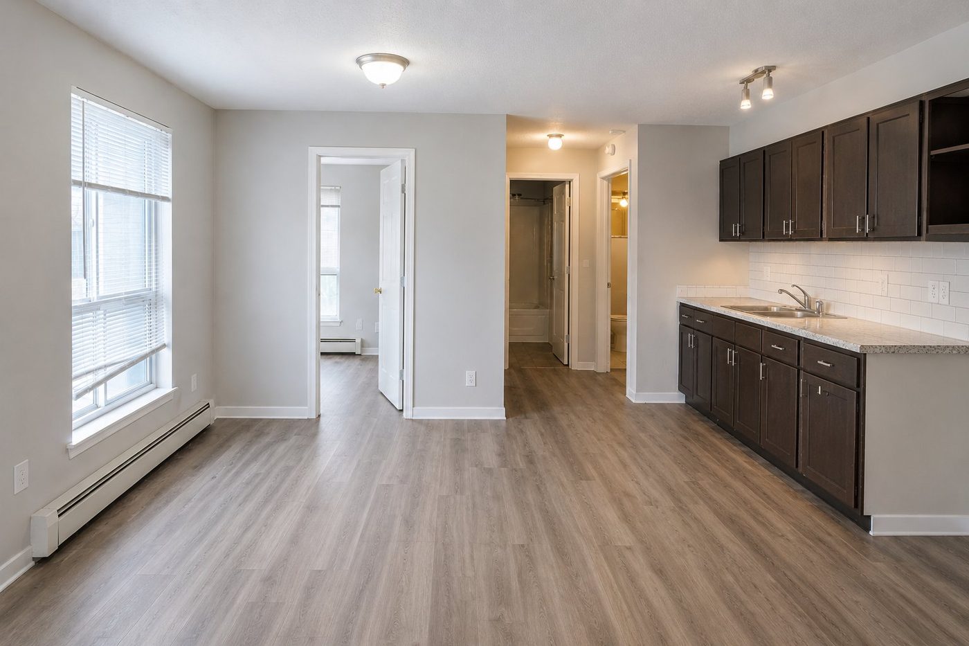 Refreshed unit with new vinyl plank flooring and backsplash